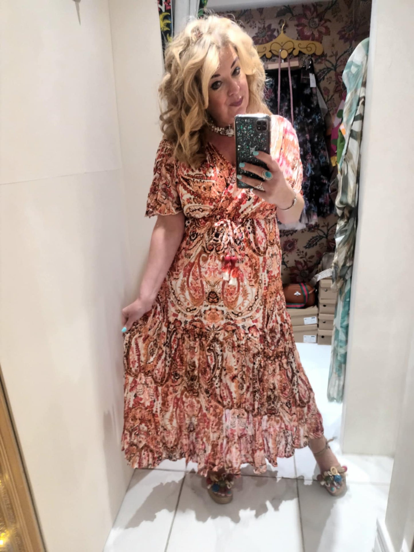 'ELEANOR; STUNNING PLISSE ANGEL SLEEVE MAGIC DRESS WITH SWISHY HEM AND TASSEL DETAIL. CORAL PRINT