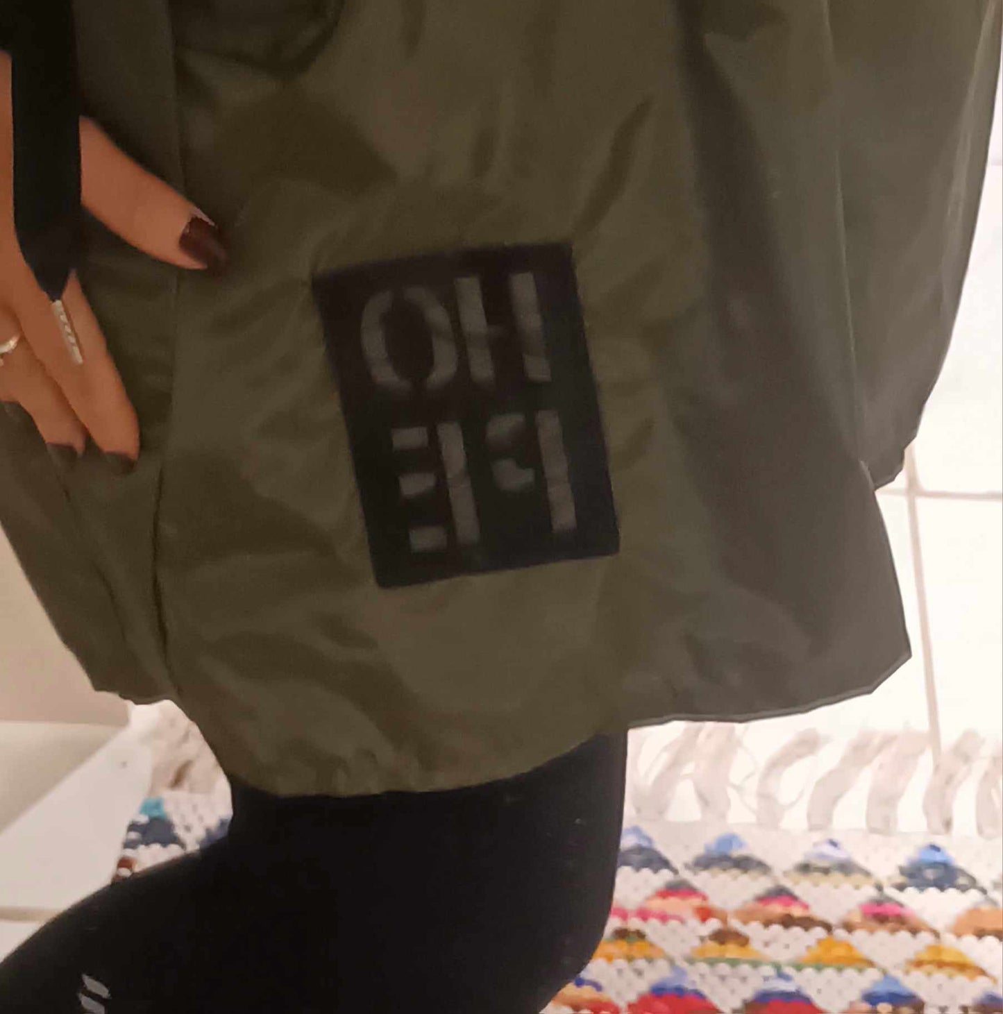 THE 'SUPERNOVA' KHAKI KAGOULE WITH HOPE MOTIF, FEATURE ZIP AND BUTTON DETAIL