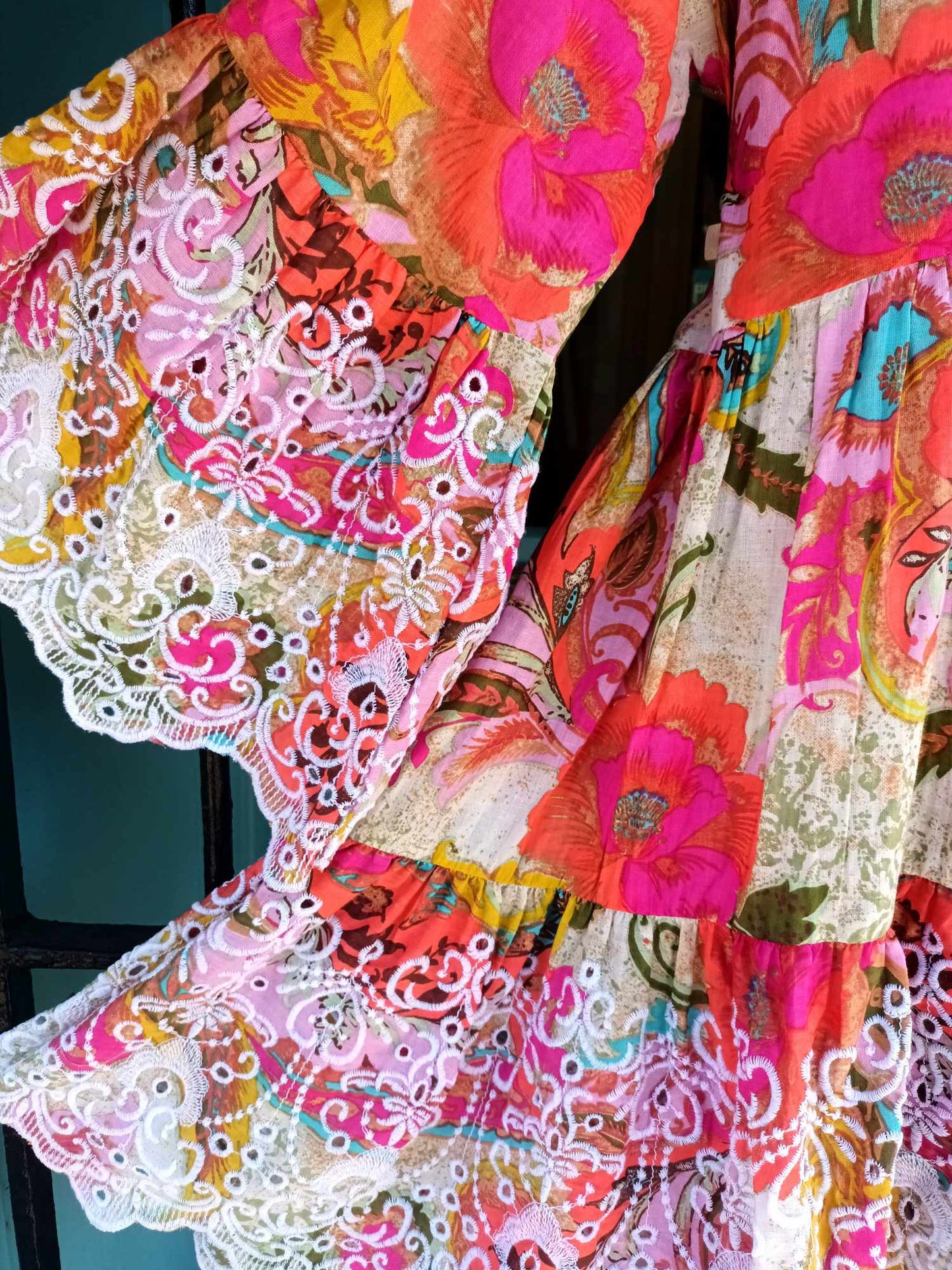 THE 'FANDANGO' BEAUTIFUL INDIAN COTTON RAINBOW FLORALS TUNIC WITH EMBROIDERED BELL SLEEVES AND HEMLINE.