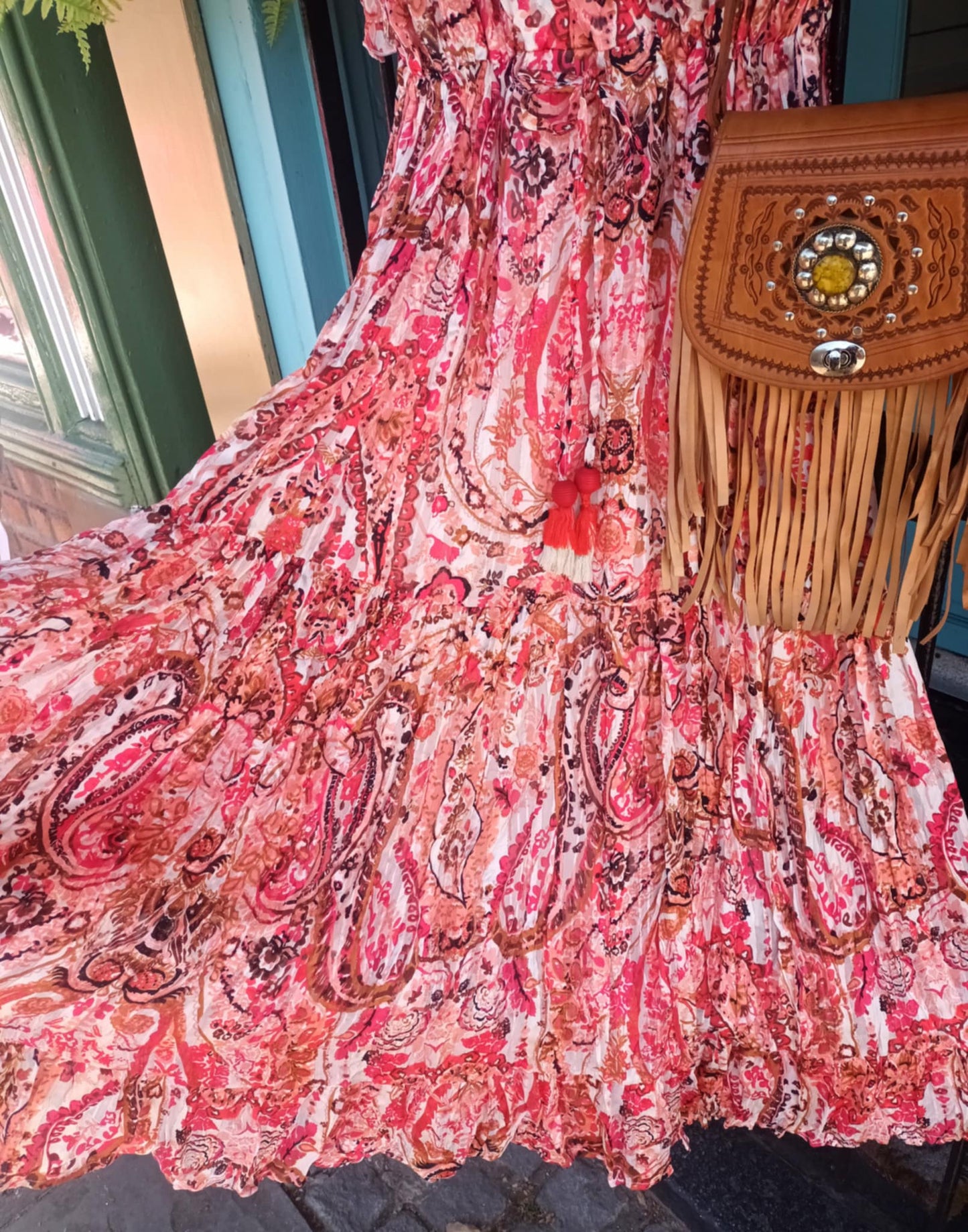 'ELEANOR; STUNNING PLISSE ANGEL SLEEVE MAGIC DRESS WITH SWISHY HEM AND TASSEL DETAIL. CORAL PRINT