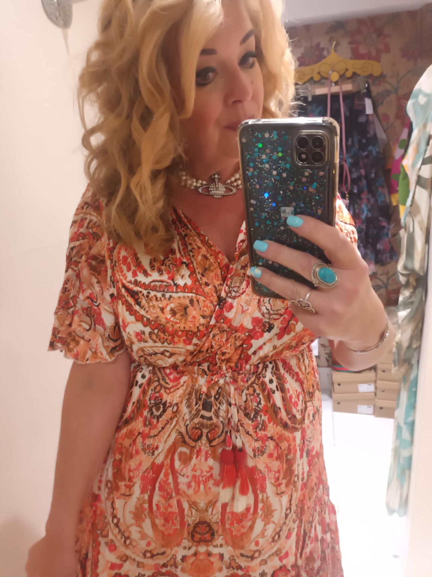 'ELEANOR; STUNNING PLISSE ANGEL SLEEVE MAGIC DRESS WITH SWISHY HEM AND TASSEL DETAIL. CORAL PRINT