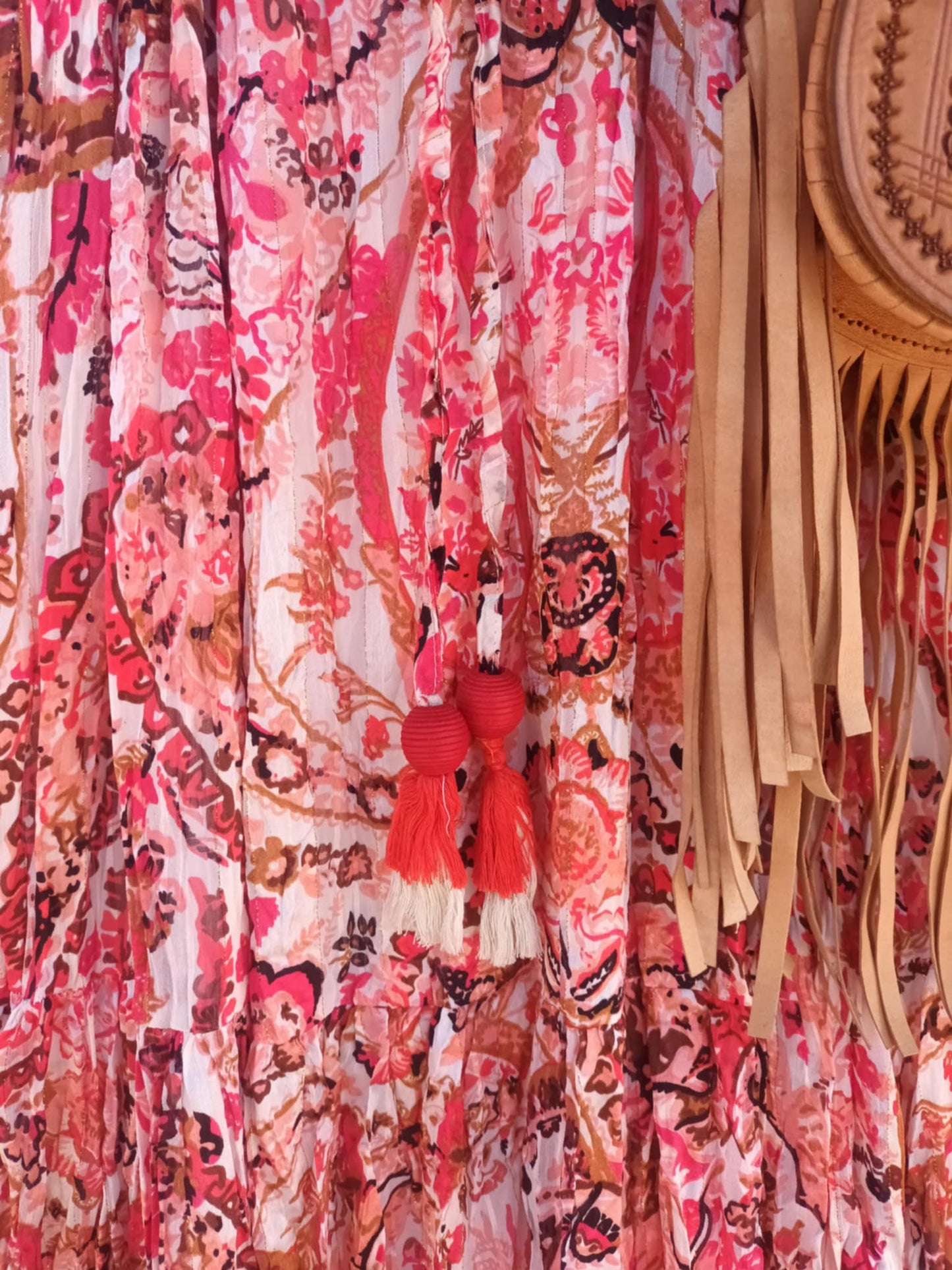 'ELEANOR; STUNNING PLISSE ANGEL SLEEVE MAGIC DRESS WITH SWISHY HEM AND TASSEL DETAIL. CORAL PRINT