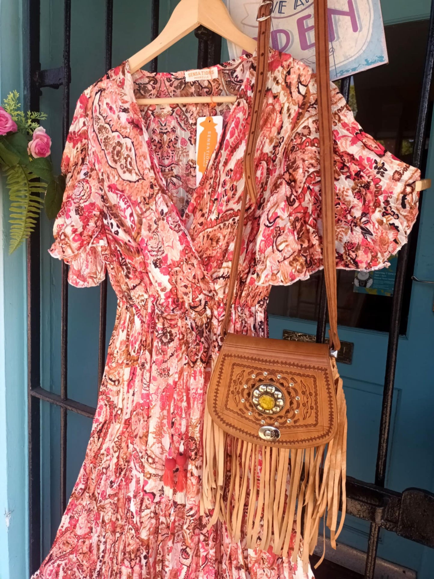 'ELEANOR; STUNNING PLISSE ANGEL SLEEVE MAGIC DRESS WITH SWISHY HEM AND TASSEL DETAIL. CORAL PRINT