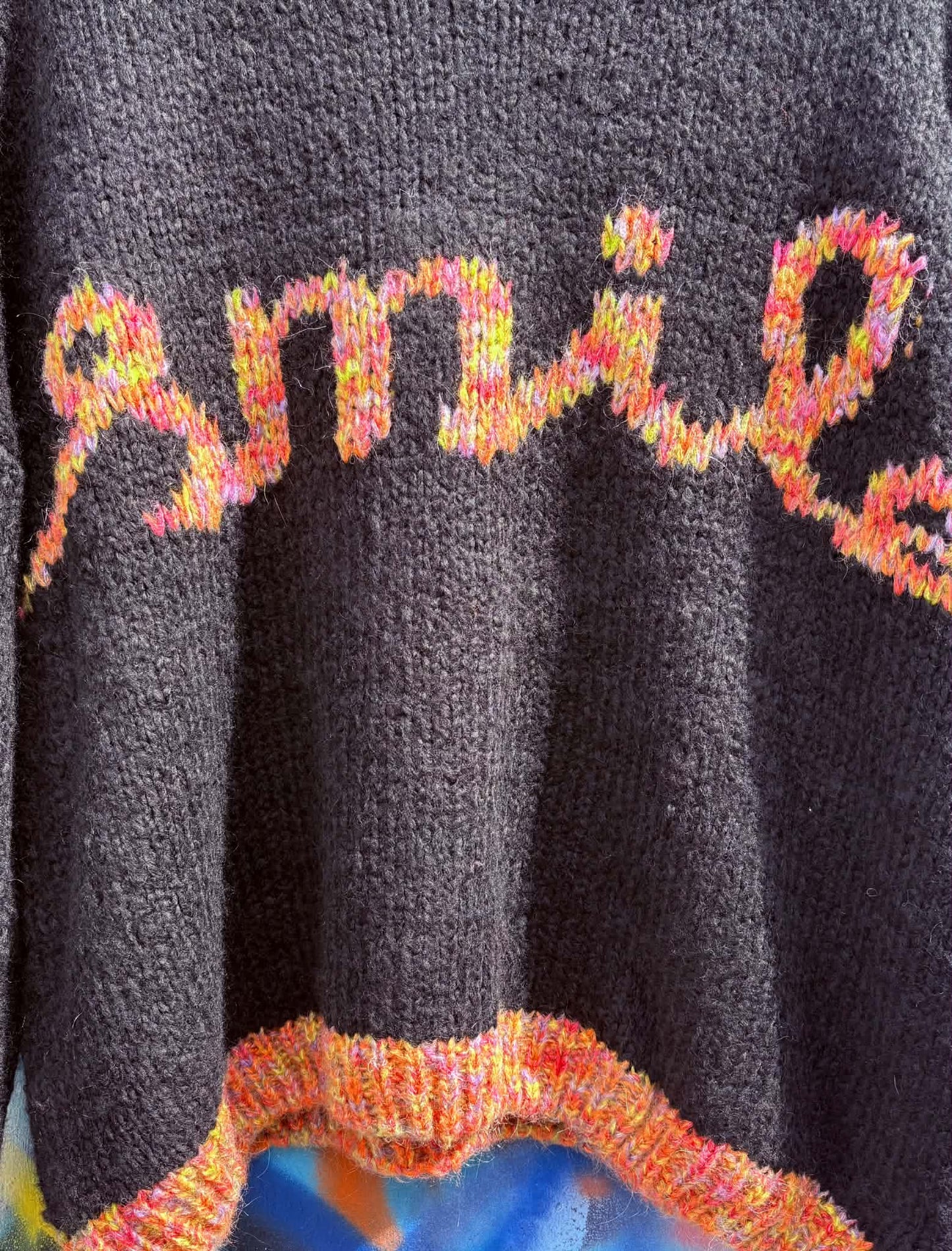 THE 'SMILE' COSY OVERSIZED SNUGGLE JUMPER IN BLACK WITH RAINBOW COLOURED SMILE MOTIF