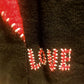THE 'LOVE IS...' CUTE AND COSY HEART PATCH CARDIGAN WITH BLANKET STITCH DETAIL