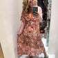 'ELEANOR; STUNNING PLISSE ANGEL SLEEVE MAGIC DRESS WITH SWISHY HEM AND TASSEL DETAIL. CORAL PRINT