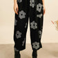 THE 'DAISY' FABULOUS RELAXED FIT RETRO DAISY PRINT POCKET DETAIL TROUSERS