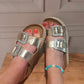 THE 'ST TROPEZ' DIAMANTE BUCKLE PLATFORM FOOTBED SLIDERS IN ANTIQUE GOLD