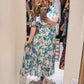 'ELEANOR' IRISES AND LILIES PRINT SWISHY HEM DRESS WITH FLATTERING FLUTTER SLEEVES