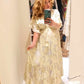 THE 'CELENE' BEAUTIFUL TASSEL DETAIL FLOATY CHIFFON BEAD EMBELLISHED DRESS IN VANILLA AND GOLD