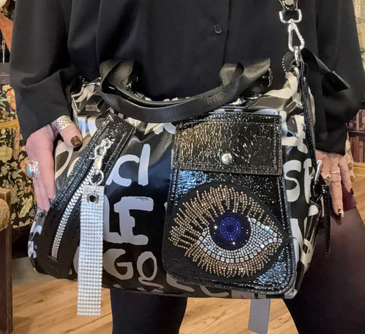 THE 'MYSTIC PUNK' GRAFFITI PRINT OVERSIZED HANDBAG WITH DIAMANTE MYSTIC EYE DETAIL
