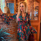THE 'MARITZA' STUNNING FLOATY BELL SLEEVE DRESS IN A BIRD OF PARADISE PRINT FROM OUR EXCLUSIVE SPANISH COLLECTION