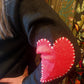 THE 'LOVE IS...' CUTE AND COSY HEART PATCH CARDIGAN WITH BLANKET STITCH DETAIL
