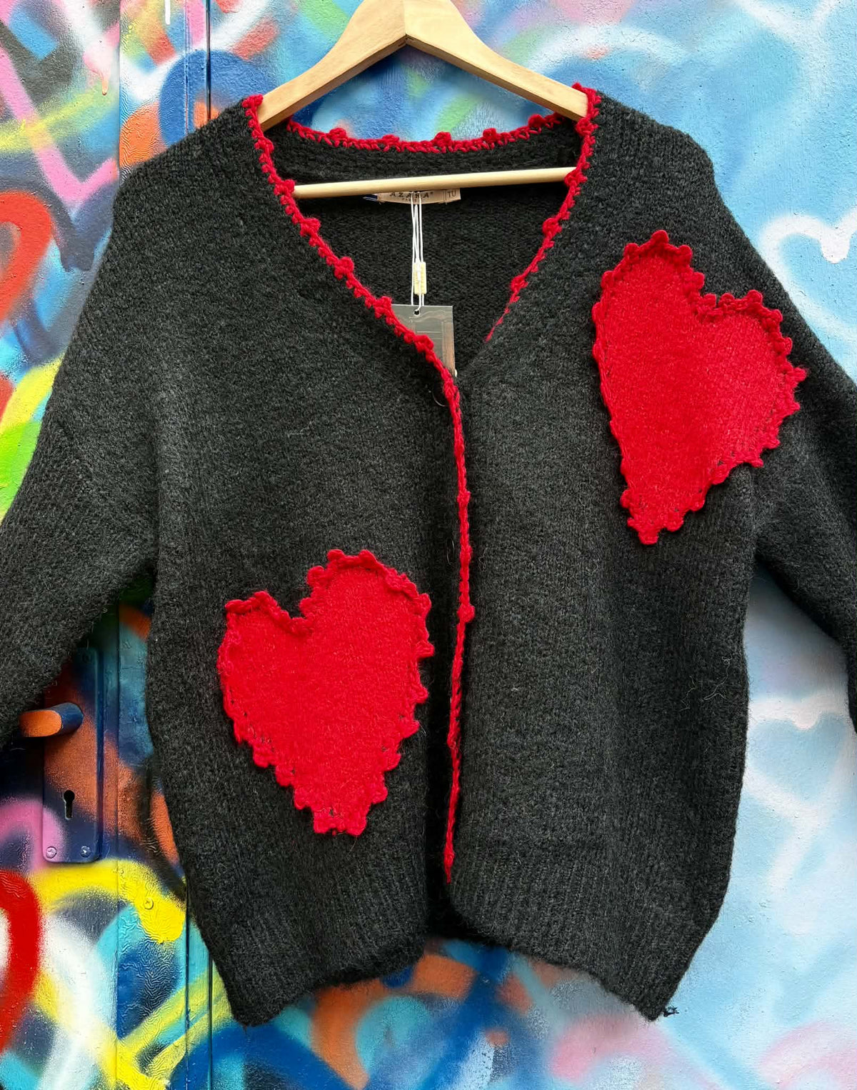 THE 'LOVE IS' SUPERSOFT FLUFFY CARDIGAN WITH APPLIQUE KNITTED HEARTS IN BLACK OR PALE GREY