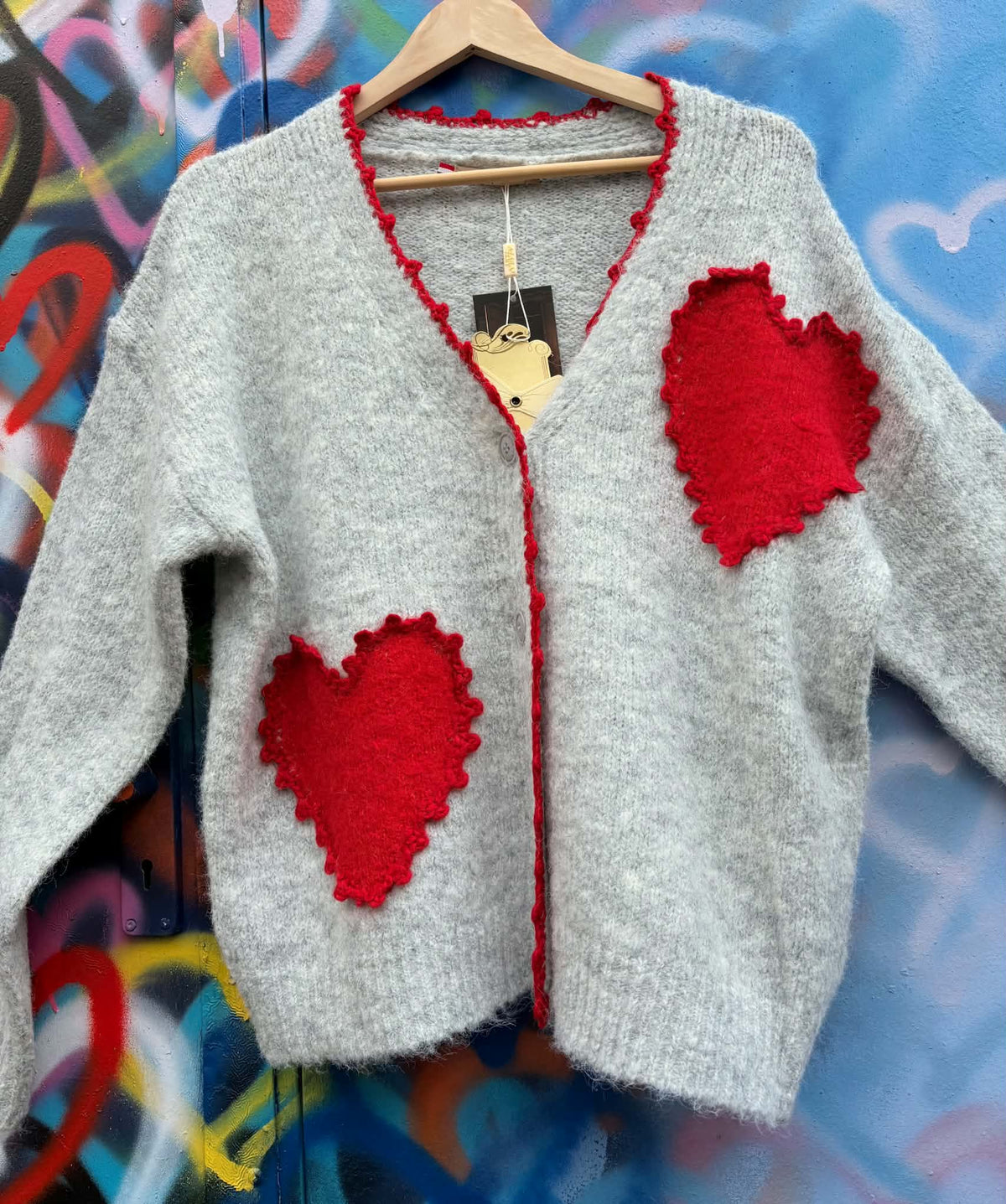 THE 'LOVE IS' SUPERSOFT FLUFFY CARDIGAN WITH APPLIQUE KNITTED HEARTS IN BLACK OR PALE GREY