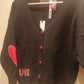 THE 'LOVE IS...' CUTE AND COSY HEART PATCH CARDIGAN WITH BLANKET STITCH DETAIL
