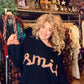THE 'SMILE' COSY OVERSIZED SNUGGLE JUMPER IN BLACK WITH RAINBOW COLOURED SMILE MOTIF
