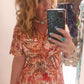'ELEANOR; STUNNING PLISSE ANGEL SLEEVE MAGIC DRESS WITH SWISHY HEM AND TASSEL DETAIL. CORAL PRINT