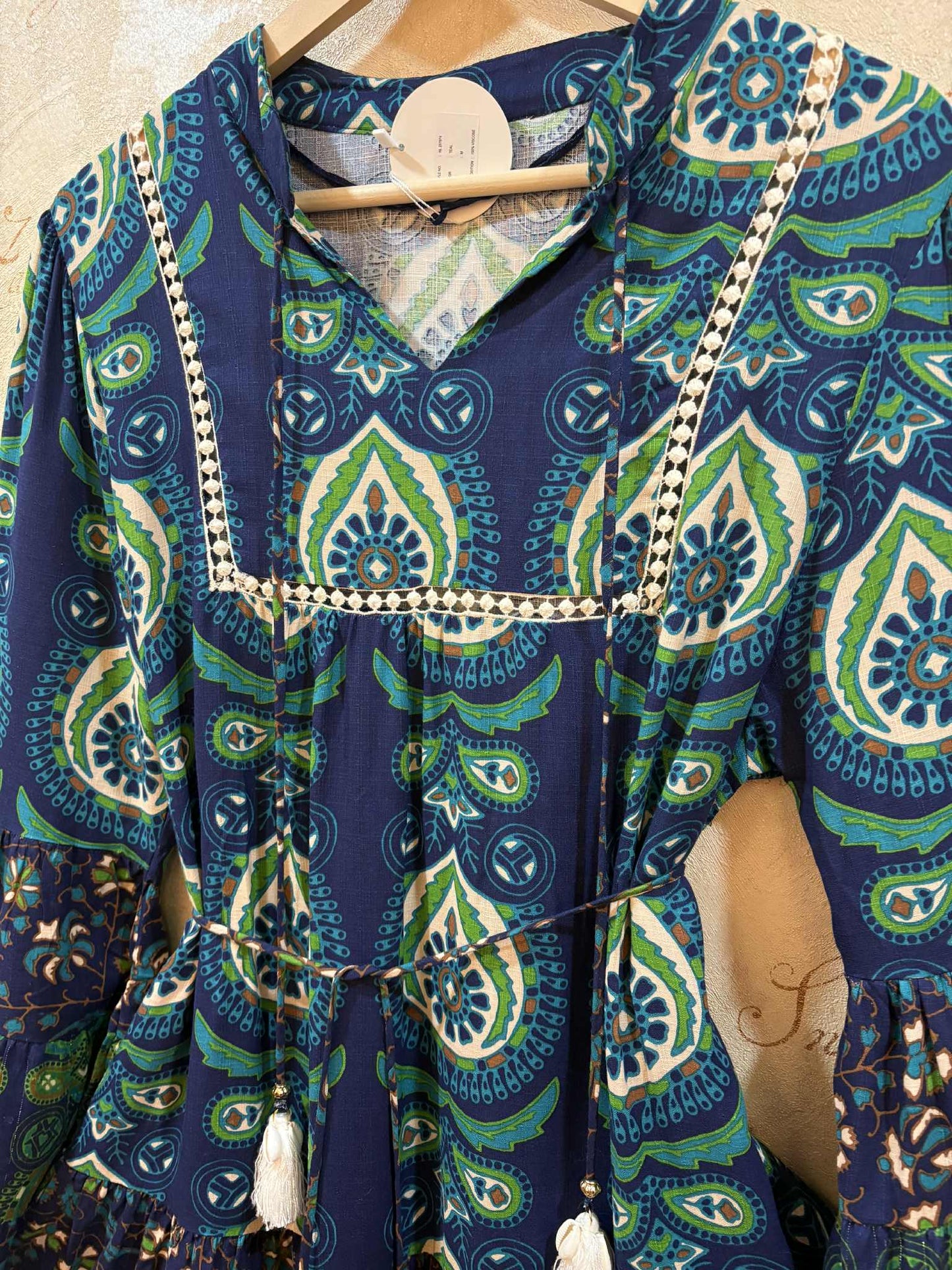 THE 'PANDORA' VINTAGE 70'S STYLE BELL SLEEVE TASSEL DETAIL DRESS WITH FULL AND FLIPPY HEMLINE