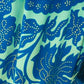 THE 'ALHAMBRA SKIES' BREATH TAKING TURQUOISE AND COBALT BOTANICAL PRINT FRILL HEM DRESS FROM OUR SPANISH COLLECTION