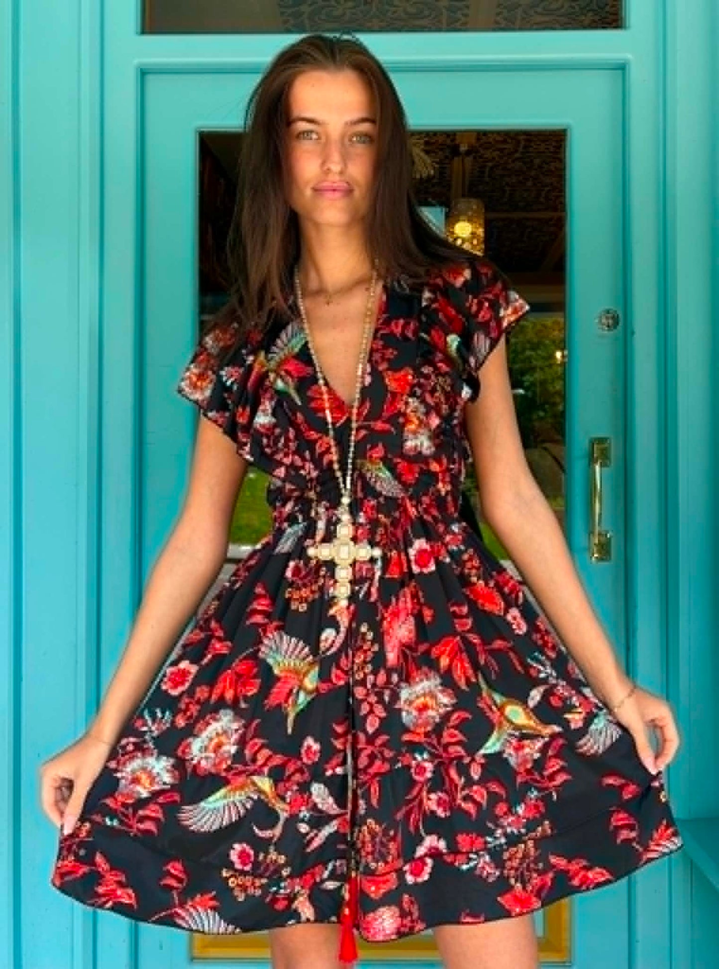 THE 'IBIZA SUNSET' VIBRANT BIRD OF PARADISE PRINT FLIPPY SUMMER DRESS WITH TASSEL BACK DETAIL FROM OUR EXCLUSIVE SPANISH COLLECTION