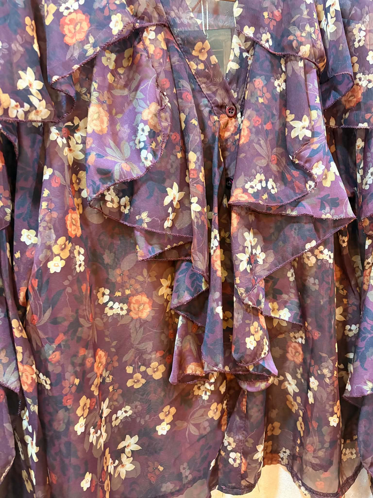THE 'CLARA' BEAUTIFUL CHIFFON BUTTON FRONT WATERFALL FRILL BLOUSE IN A PLUM AND SPICE DITSY PRINT