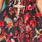 THE 'IBIZA SUNSET' VIBRANT BIRD OF PARADISE PRINT FLIPPY SUMMER DRESS WITH TASSEL BACK DETAIL FROM OUR EXCLUSIVE SPANISH COLLECTION