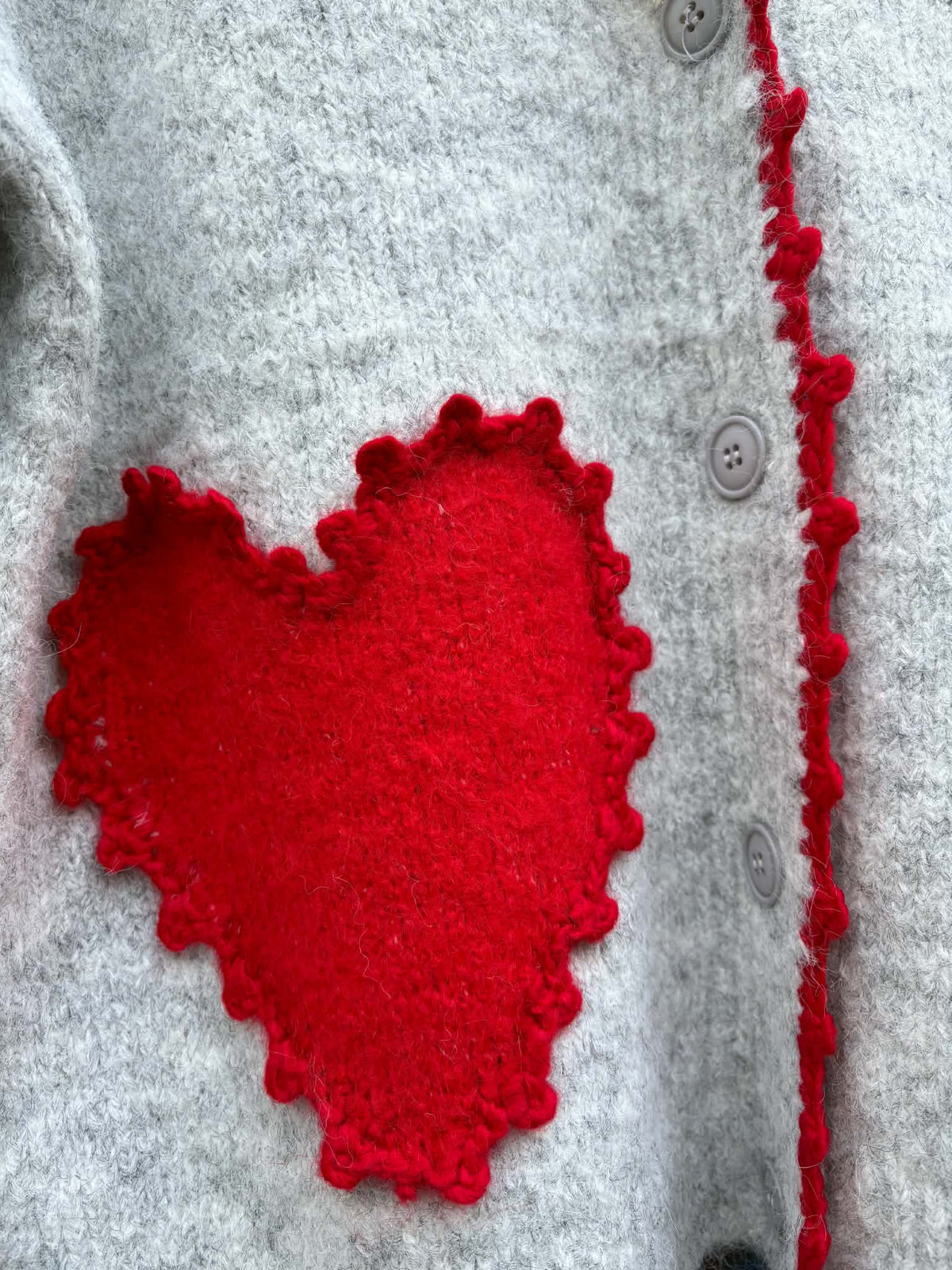 THE 'LOVE IS' SUPERSOFT FLUFFY CARDIGAN WITH APPLIQUE KNITTED HEARTS IN BLACK OR PALE GREY