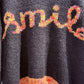 THE 'SMILE' COSY OVERSIZED SNUGGLE JUMPER IN BLACK WITH RAINBOW COLOURED SMILE MOTIF