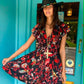 THE 'IBIZA SUNSET' VIBRANT BIRD OF PARADISE PRINT FLIPPY SUMMER DRESS WITH TASSEL BACK DETAIL FROM OUR EXCLUSIVE SPANISH COLLECTION